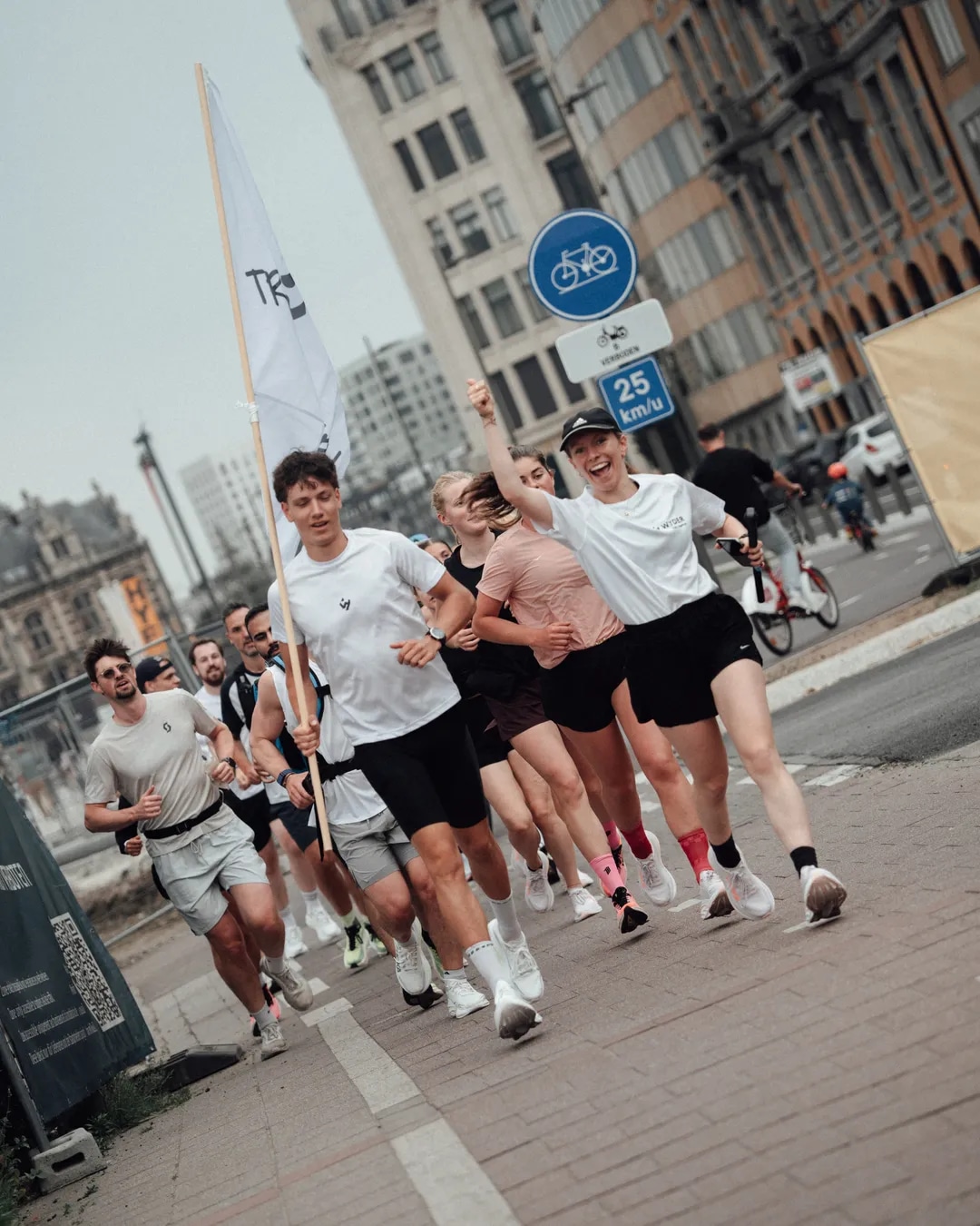 A Wyder run club moving through the city with flags up
